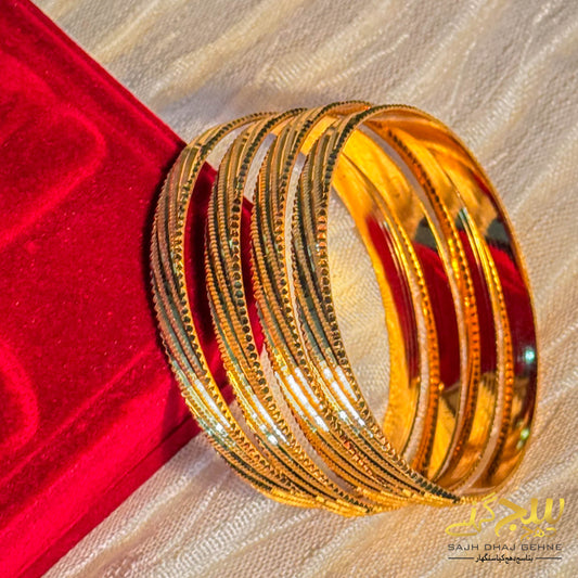 EDGE OF ELEGANCE SERRATED GOLD BANGLES